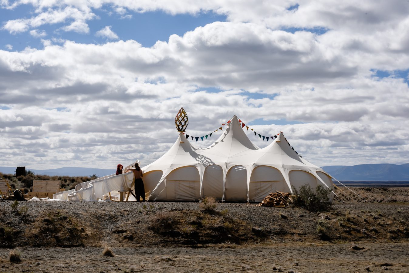 Camp mates raising the Lotus Mahal, the camp's temple tent, on the open playa