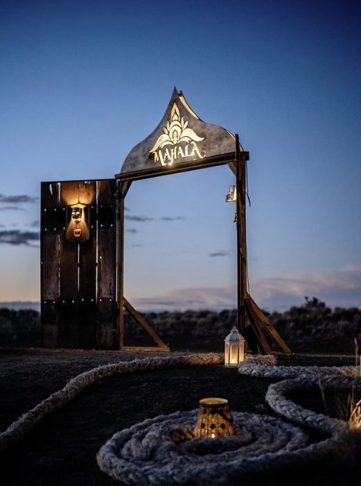 The Mahala gate at dusk, with lanterns on coiled rope